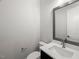 Modern half bath with a sleek vanity, undermount sink, and neutral tones at 9004 Penny Rd, Raleigh, NC 27606