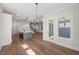 Open concept area featuring a modern kitchen, large island, and hardwood floors at 9004 Penny Rd, Raleigh, NC 27606
