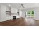 Bright and open living space with hardwood floors and a modern fireplace at 9004 Penny Rd, Raleigh, NC 27606