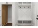 Mudroom with storage cubbies, bench and hooks, and a stylish design at 9004 Penny Rd, Raleigh, NC 27606