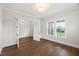 Versatile office with hardwood floors, neutral walls, and glass doors to another space at 9004 Penny Rd, Raleigh, NC 27606