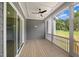 Inviting screened porch features wood flooring, ceiling fan and access to the outdoors with lots of natural light at 9004 Penny Rd, Raleigh, NC 27606