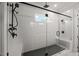 Walk-in shower with black fixtures and rain shower head is encased in glass with black hardware at 9004 Penny Rd, Raleigh, NC 27606