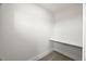 Small walk-in closet with carpet and a built-in shelf at 9004 Penny Rd, Raleigh, NC 27606