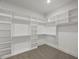 Large walk-in closet with custom shelving units and ample hanging and storage space at 9004 Penny Rd, Raleigh, NC 27606