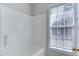 Bathroom with shower and window that allows natural light at 9537 Hanging Rock Rd, Raleigh, NC 27613