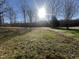 Large grassy backyard, with mature trees and natural light, perfect for outdoor recreation at 101 Feezor Ct, Clayton, NC 27527