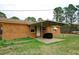 Brick home featuring a covered patio, ideal for outdoor relaxation and enjoyment at 10125 Buffalo Rd, Clayton, NC 27527