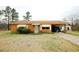 Charming brick home with covered carport and mature landscaping at 10125 Buffalo Rd, Clayton, NC 27527