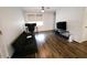 Cozy living room featuring sleek, wood-look flooring and ample natural light at 10125 Buffalo Rd, Clayton, NC 27527