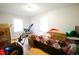 Bedroom with hardwood floors, lots of boxes and minimal decor at 10166 Buffalo Rd, Clayton, NC 27527