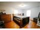 Bedroom with hardwood floors and bright natural light at 10166 Buffalo Rd, Clayton, NC 27527