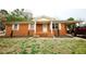 Charming brick home featuring a covered porch and carport on a well-maintained lot at 10166 Buffalo Rd, Clayton, NC 27527