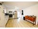 Functional kitchen with white cabinetry, stainless steel appliances, and durable floors at 10166 Buffalo Rd, Clayton, NC 27527