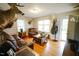 Inviting living room with hardwood floors, natural light, and unique decor at 10166 Buffalo Rd, Clayton, NC 27527