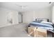 Bedroom with ensuite bath featuring a ceiling fan and neutral decor at 104 Hampshire Pl, Chapel Hill, NC 27516