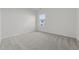 Cozy bedroom with neutral carpet, bright natural light and view to neighborhood at 116 Oat Grain Ct, Clayton, NC 27520