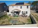 Home featuring backyard with a patio, table, fenced-in yard, and solar panels on the roof at 138 Daneborg Rd, Durham, NC 27703