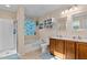 Bright bathroom featuring dual sinks, a soaking tub, and a separate shower, creating a spa-like experience at 138 Daneborg Rd, Durham, NC 27703
