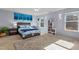Serene bedroom with a bed, nightstands, modern decor, and large windows for ample natural light at 138 Daneborg Rd, Durham, NC 27703