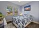 Well-lit bedroom with hardwood floors, stylish bedding, and dual windows, creating a relaxing space at 138 Daneborg Rd, Durham, NC 27703