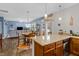 Open-concept kitchen with granite countertops, stainless steel appliances, and an adjacent dining area at 138 Daneborg Rd, Durham, NC 27703