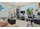Bright living room featuring large windows, comfortable seating, and stylish decor at 138 Daneborg Rd, Durham, NC 27703