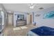 Spacious main bedroom featuring calming blue walls, dresser, and a ceiling fan at 138 Daneborg Rd, Durham, NC 27703