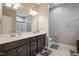 Bathroom with double sink vanity, modern fixtures, and ample counter space at 203 Mitchell Manor Dr, Angier, NC 27501