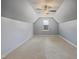 Spacious empty room with neutral carpet, a window, and a ceiling fan, ready for personalization at 203 Mitchell Manor Dr, Angier, NC 27501