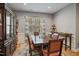 Formal dining room with a large wooden table, elegant chairs, and a decorative hutch under a large window at 203 Mitchell Manor Dr, Angier, NC 27501