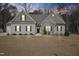 Charming one-story home with stone accents, symmetrical windows, and a well-manicured lawn at 203 Mitchell Manor Dr, Angier, NC 27501
