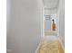 Bright hallway featuring hardwood floors, neutral paint, and an inviting area rug at 203 Mitchell Manor Dr, Angier, NC 27501
