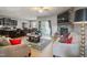 Inviting living room with a stone fireplace, plush seating, and a stylish rug on the hardwood floors at 203 Mitchell Manor Dr, Angier, NC 27501