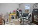 Functional office space featuring neutral walls, a desk, and a comfortable chair at 203 Mitchell Manor Dr, Angier, NC 27501