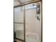 Shower featuring modern fixtures, a glass door, and built-in storage shelves at 203 Mitchell Manor Dr, Angier, NC 27501