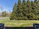 Large backyard with mature trees at 205 Cedar Elm Rd, Durham, NC 27713