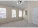 Bedroom with natural light and carpeted floor at 205 Cedar Elm Rd, Durham, NC 27713