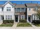 Charming townhome featuring a well-manicured lawn and traditional architectural details at 205 Cedar Elm Rd, Durham, NC 27713