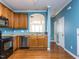 Kitchen featuring stainless steel appliances and hardwood floors at 205 Cedar Elm Rd, Durham, NC 27713