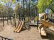 Community playground with slides and climbing structure at 205 Cedar Elm Rd, Durham, NC 27713