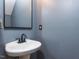 The half bath features a single sink and modern fixtures at 205 Cedar Elm Rd, Durham, NC 27713