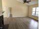 Bright living room featuring a fireplace and wood-look flooring at 212 Davis Farm Dr, Selma, NC 27576