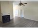 Open living room with high ceilings, fireplace, and wood-look flooring at 212 Davis Farm Dr, Selma, NC 27576