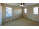 Cozy carpeted bedroom with natural light and ceiling fan at 212 Liberty Rose Dr, Morrisville, NC 27560