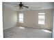 Bedroom featuring neutral carpet, ceiling fan, and natural lighting at 212 Liberty Rose Dr, Morrisville, NC 27560