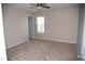 Neutral bedroom features carpet, ceiling fan, and natural light through the window at 212 Liberty Rose Dr, Morrisville, NC 27560