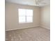 Neutral bedroom with plush carpet, one window, and a ceiling fan at 212 Liberty Rose Dr, Morrisville, NC 27560
