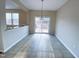 Bright dining area featuring sliding glass doors to a deck and neutral flooring at 212 Liberty Rose Dr, Morrisville, NC 27560