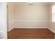 Spacious dining room with hardwood floors, and bright window at 212 Liberty Rose Dr, Morrisville, NC 27560